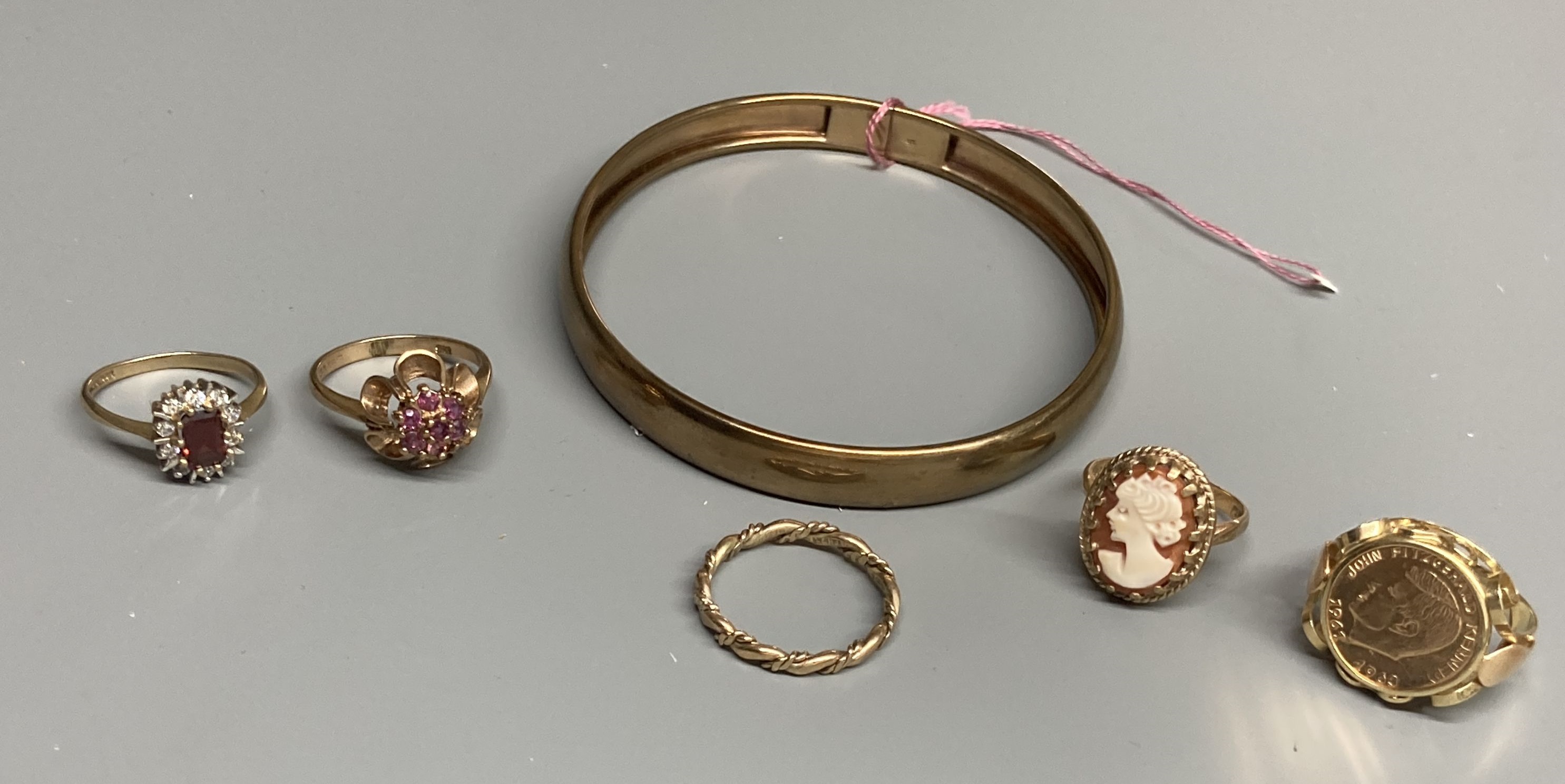 Four assorted modern 9ct gold and gem set rings and a 375 bangle, gross 18 grams and a 585 ring, gross 3.5 grams.